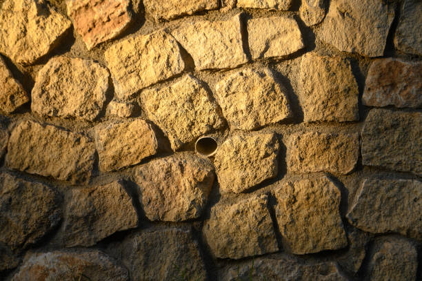 wall made of real stone as a background in the sun 1