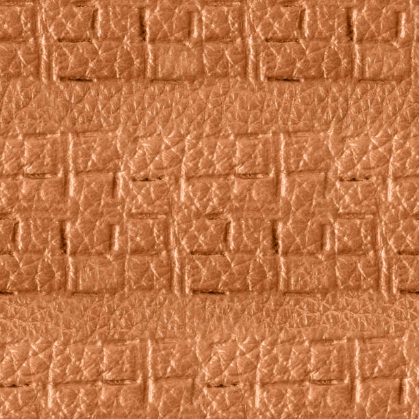 istock Seamless 4k photo texture of light brown leather embossed with square shaped pattern ornament. 2162592355