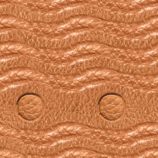 Seamless 4k photo texture of light brown leather embossed with weave pattern line and circles.