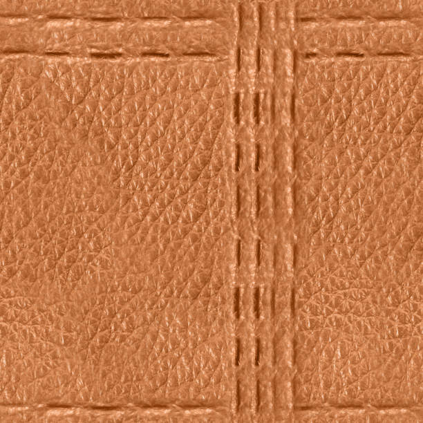 istock Seamless 4k photo texture of light brown leather embossed with stitch line mesh pattern. 2162592526