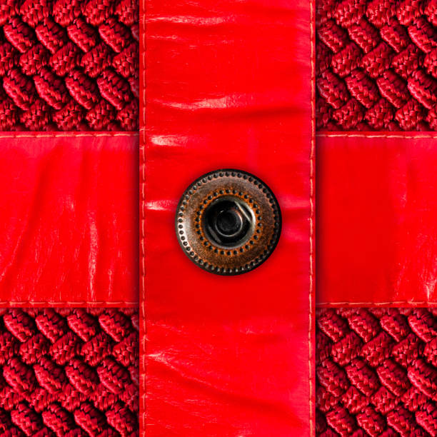 A closeup picture of a faded light blue jeans pant with button. Textile industry theme