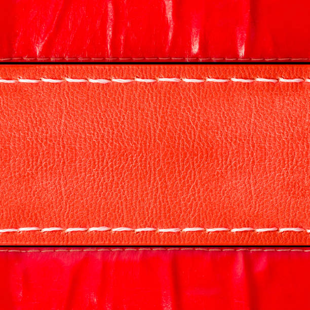 istock Seamless 4k photo texture of red colored and polished leather belt pattern with stitching. 2162593835