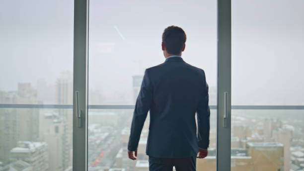 istock Ceo silhouette thinking future career cityscape view. Pensive man enjoying break 2162594525