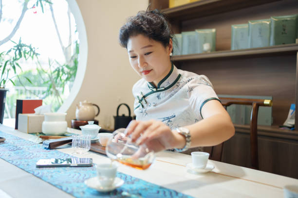 istock Asian tea sommelier pouring tea 2162596425