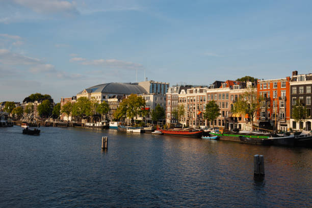 view of canal, building and boat in Amsterdam