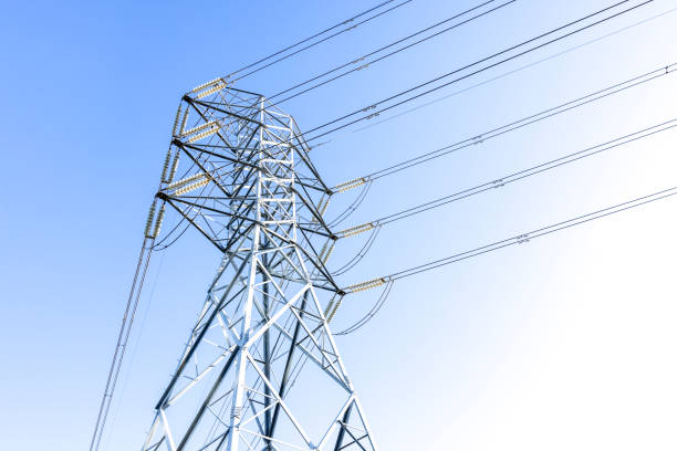 Low angle view of Electricity pylon against blue clear sky, copy space, full frame horizontal composition