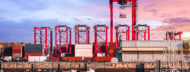istock Port with red cranes at sunset 2162604275