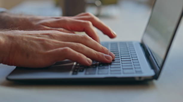 istock Closeup man hands typing pc keyboard in office. Busy manager surfing internet 2162605542