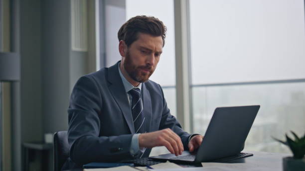 istock Tired businessman reading document at workplace closeup. Man examining papers 2162606267