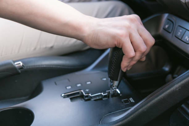 istock Driver hold on to the shift lever of the automatic transmission. 2162607117