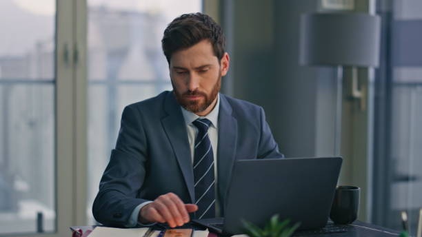 istock Serious specialist working laptop sitting office closeup. Man typing computer 2162609007