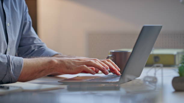 istock Manager hands typing laptop keyboard sitting desk closeup. Man working computer 2162609698