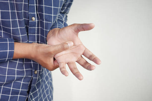 istock man suffering pain in hand close up 2162610058