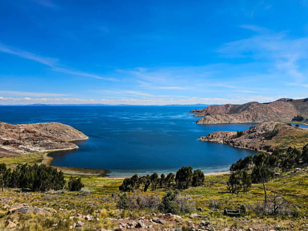 istock Lake bay with beach and trees. 2162611692