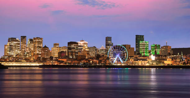 istock Montreal skyline and St Lawrence River at dusk with pink sky background 2162614344