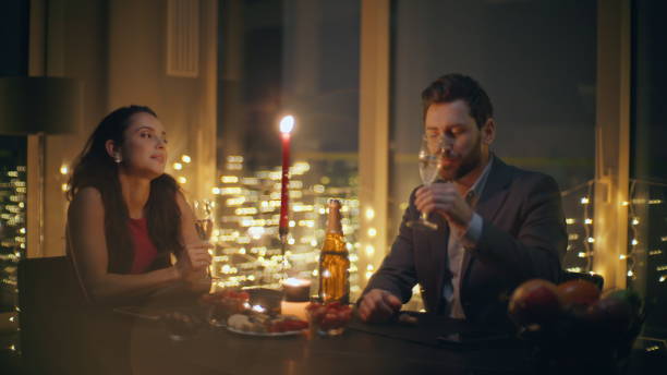 istock Romantic spouses flirting night at candles room closeup. Pair drinking wine 2162616670