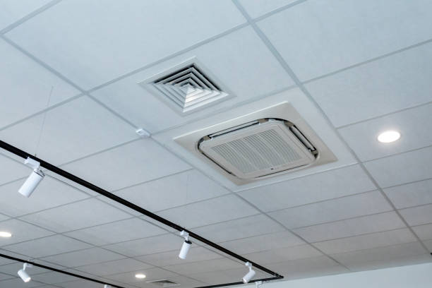 Air conditioning on ceiling. Suspended ceiling with air conditioning, ventilation and pendant lights