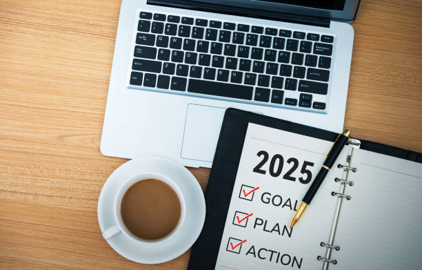 istock 2025 new year resolutions on notepad with coffee and laptop 2162617977