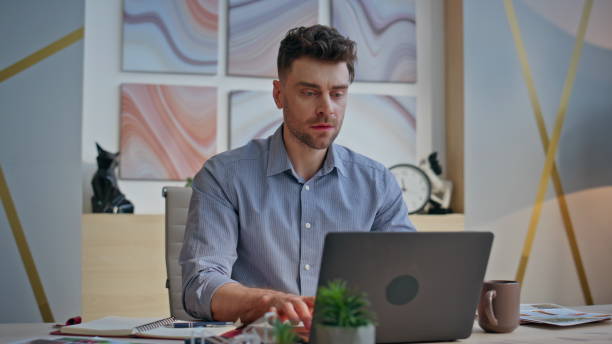 istock Pensive boss working laptop creating ideas at desk closeup. Winner man rejoicing 2162618129