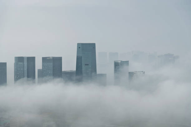 istock Office buildings covering with fog 2162618322