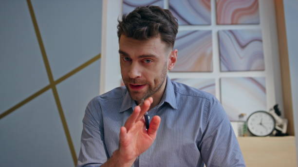 istock Angry boss videocalling remotely at office pov portrait. Stressed man arguing 2162619967
