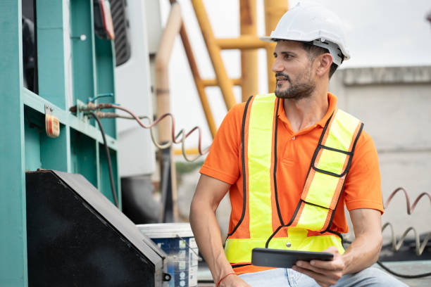 istock Portrait Hispanic latin engineer man with truck use tablet computer at construction site 2162621279