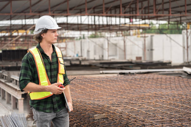 istock Happy Portrait caucasian engineer man use tablet computer working at precast cement outdoor factory 2162621302