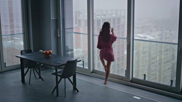 She looks off to distant scene