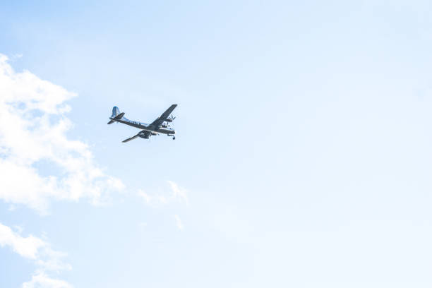 Sea plane flying on blue sky in Maldives