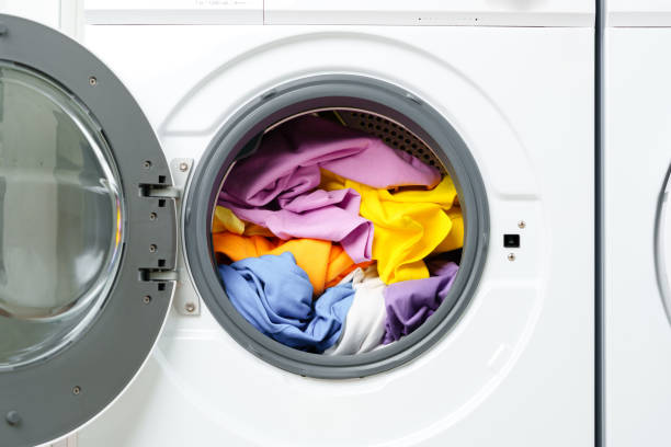 istock White Washing Machine With Open Door in a Laundry Room 2162624690
