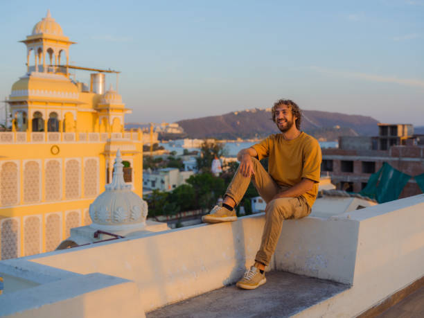 istock Man sitting on balcony  during trip to Udaipur 2162624728