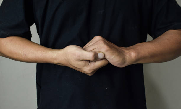 istock Young deaf mute man using sign language on beige background 2162625662