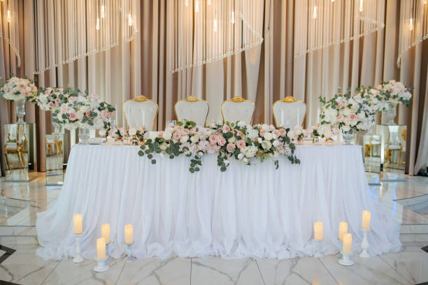 istock table in a restaurant decorated with flowers and candles. 2162625942