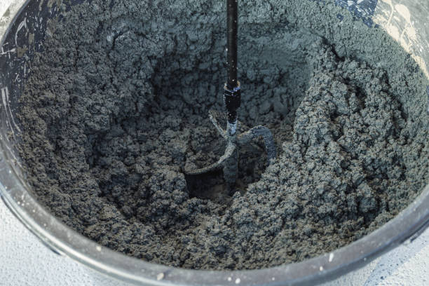 istock handheld electric concrete mixer on construction site 2162627588