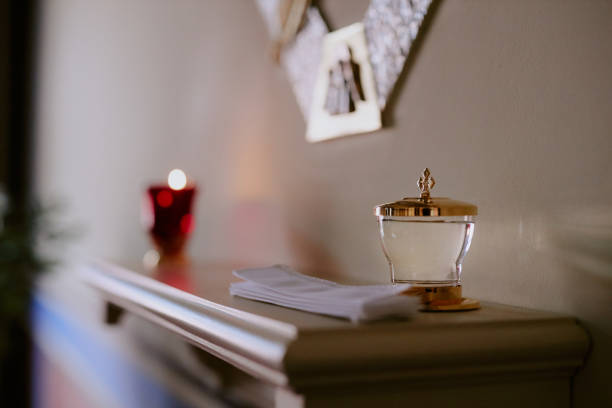 No people selective focus shot of holy water vessel on altar in Catholic church
