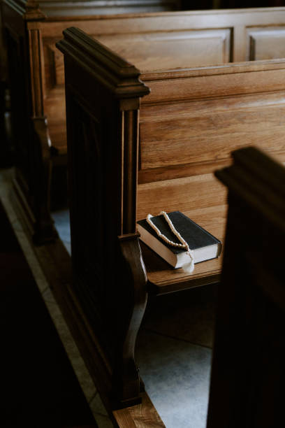 istock Prayer Book And Rosary On Bench 2162629749