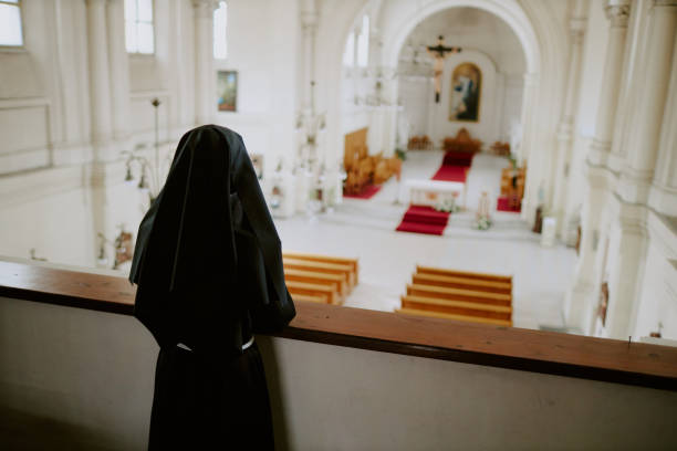 istock Unrecognizable Nun At Mezzanine 2162629954