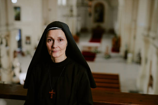 istock Mature Nun Looking At Camera 2162630028