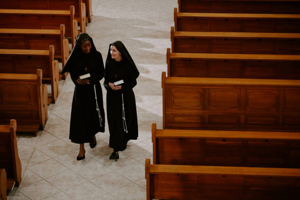 Catholic Nun Wearing Grey Religious Habit Tunic Saying Prayer During Holy Mass