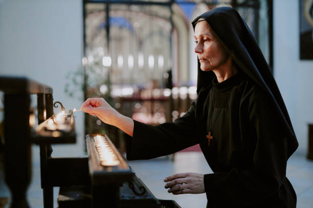 40+ Nun With A Burning Candle Stock Photos, Pictures & Royalty
