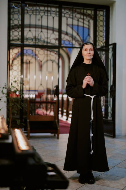 istock Mature Catholic Nun Standing At Cathedral 2162630378
