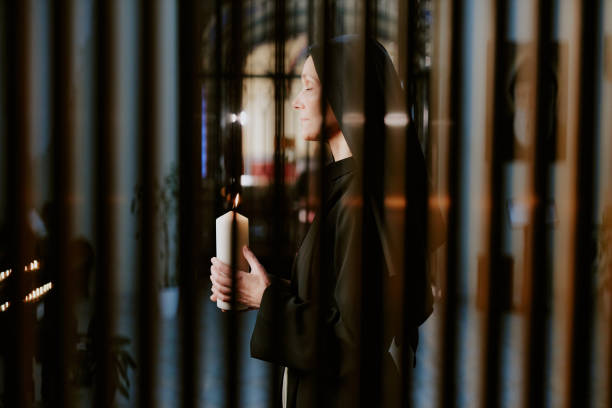 40+ Nun With A Burning Candle Stock Photos, Pictures & Royalty