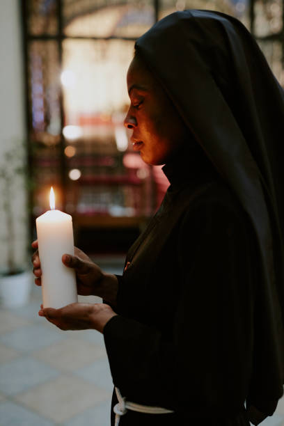 40+ Nun With A Burning Candle Stock Photos, Pictures & Royalty