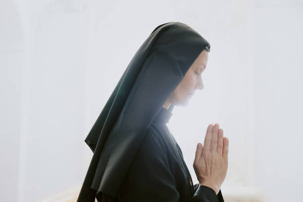 istock Mature Nun With Praying Hands 2162631493