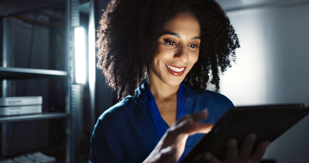 istock Server room, woman and digital tablet for inspection, maintenance and system update. Software management, programmer and tech for problem solving, cybersecurity or troubleshooting of network at night 2162632088