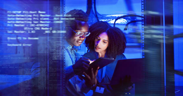 istock Man, woman and tablet with overlay for technology, maintenance in dark data center or software code. Teamwork, digital information and cloud computing with app, network programming or problem solving 2162632123