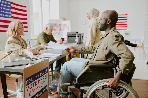 istock Black Man With Disability At Polling Station 2162634193
