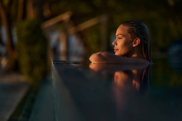 istock Sensual woman during summer day in the pool. 2162636651