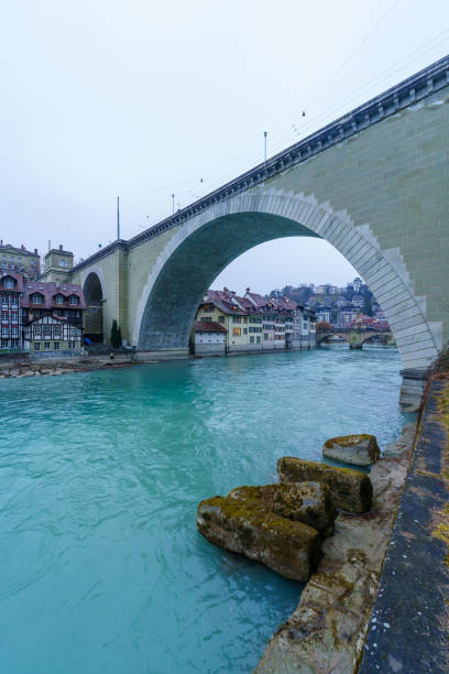 View of the Aare River, and Nydegg Bridge, with various buildings, in Bern, Switzerland