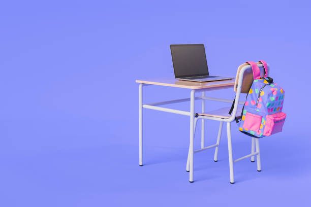 istock School Desk with Laptop and Colorful Backpack in a Studio Setup 2162638640